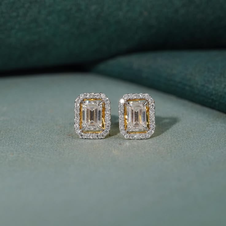 Pair of emerald-cut diamond halo stud earrings