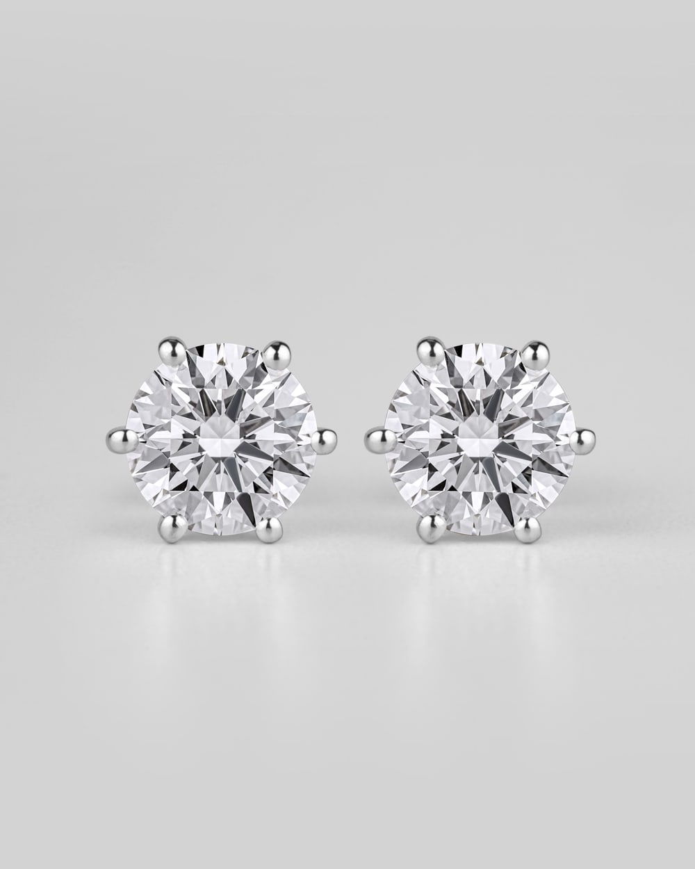 Pair of round diamond six-prong stud earrings